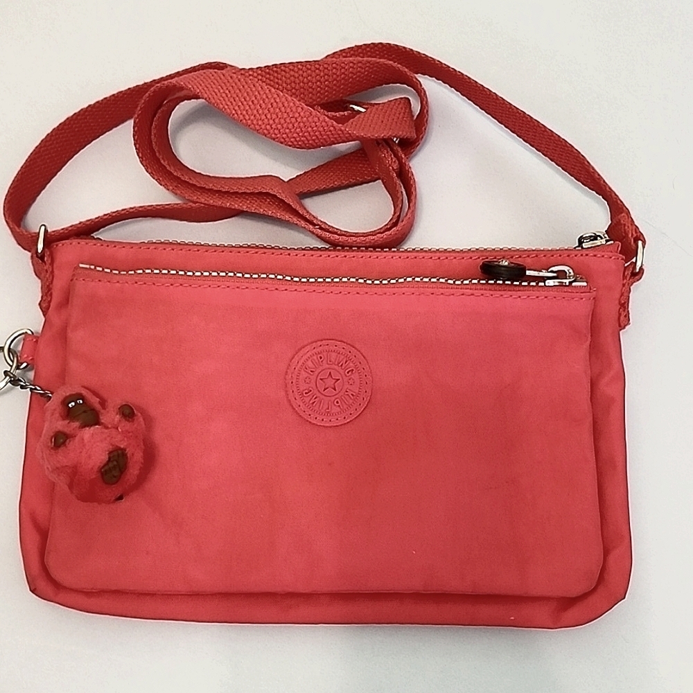 Used Kipling‎ pink crossbody with gorilla